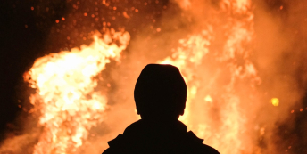 Image of someone looking at a fire